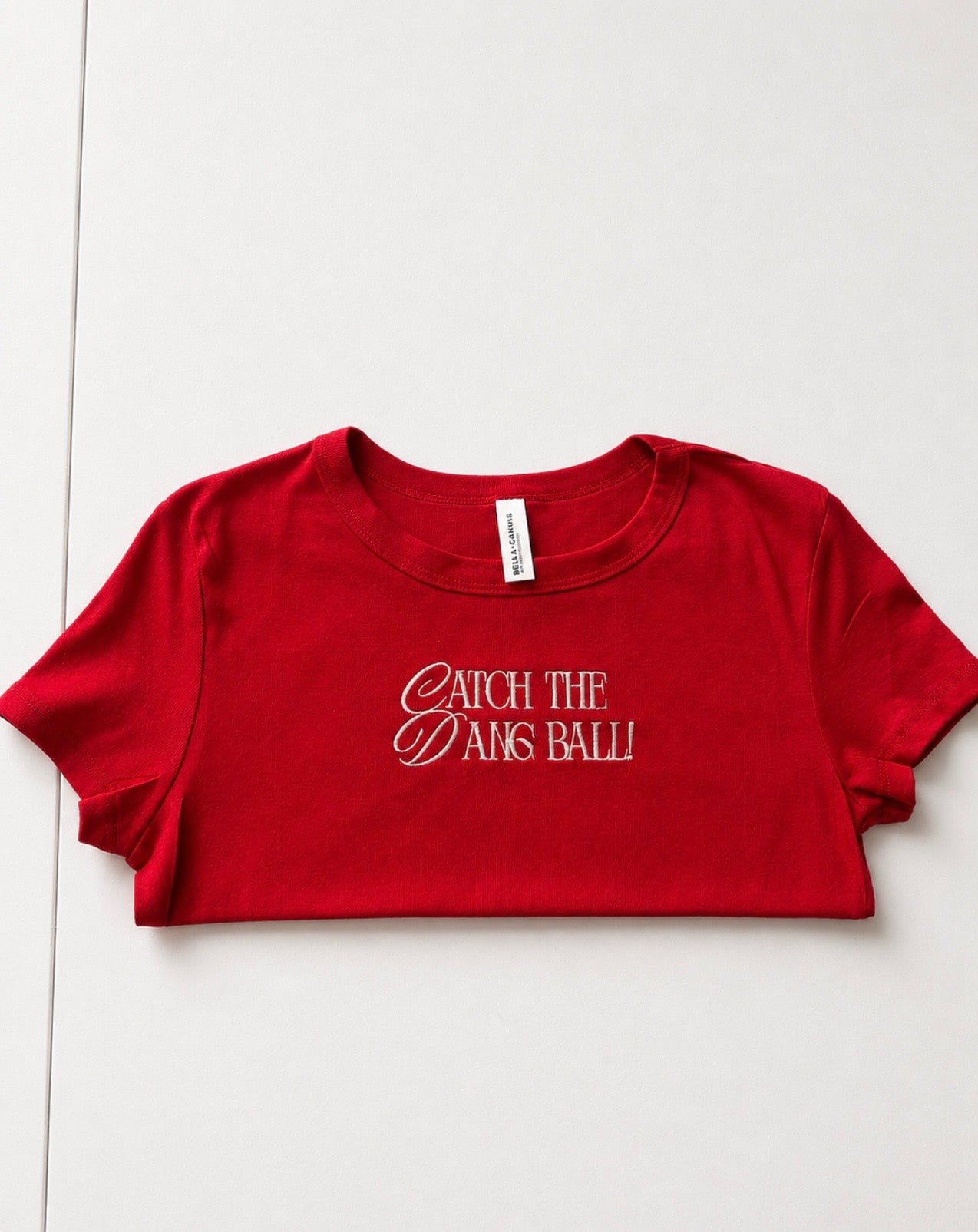 Catch the dang ball baby tee
